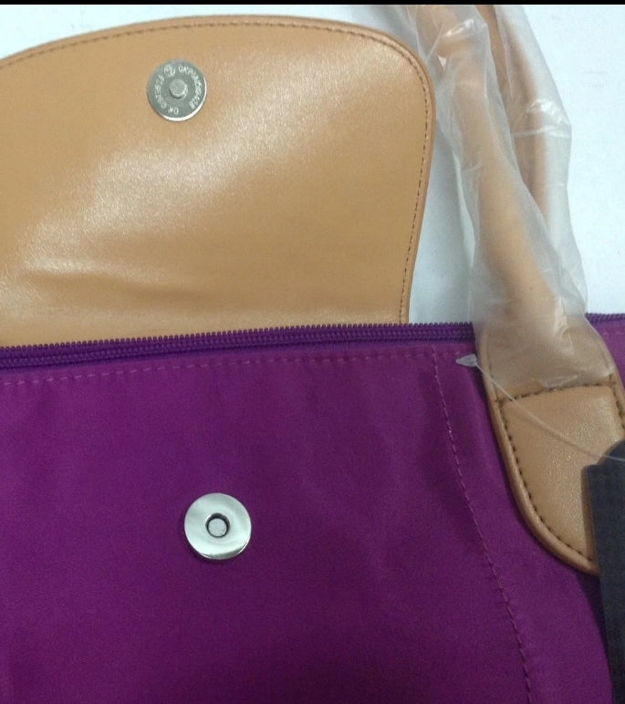 New with tags! Zipper closure with a snap flap, inside pockets, original plastic packaging! Vivid violet color